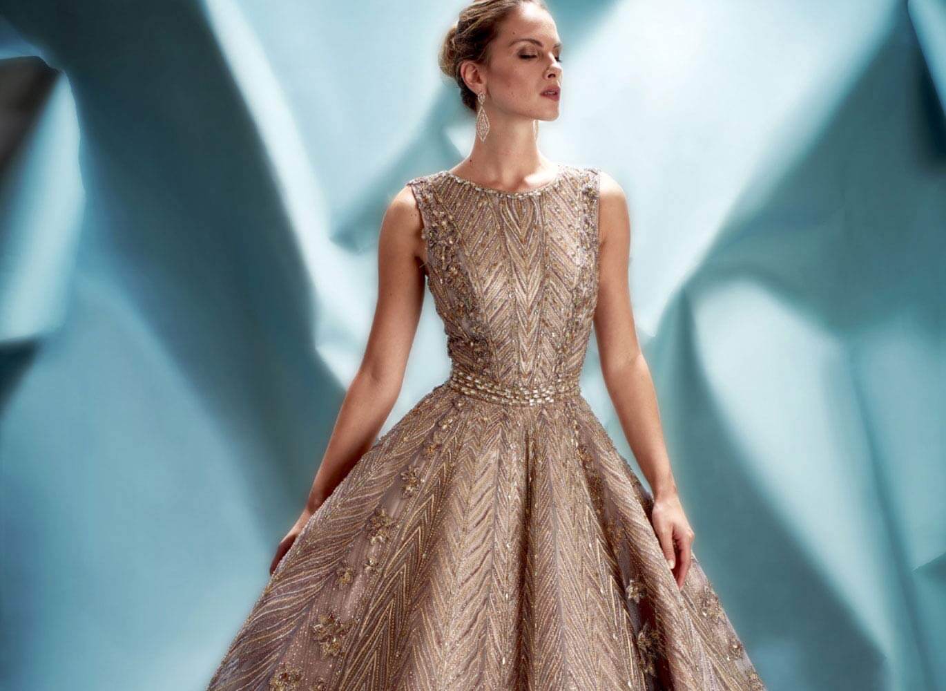 Model wearing a sparkling social occasion gown