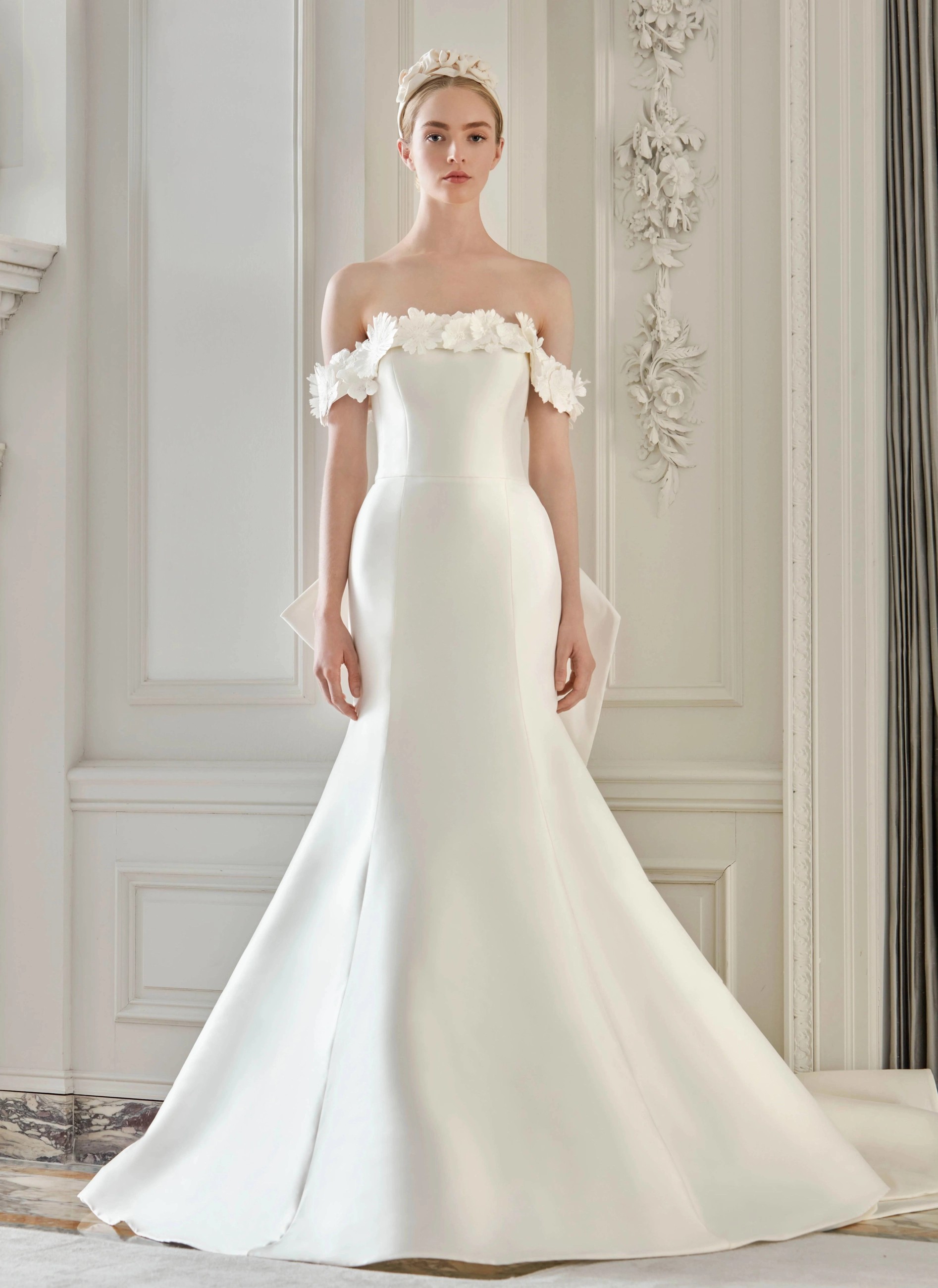 Model wearing a white Anne Barge gown
