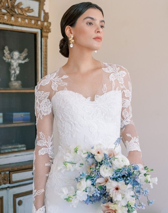 Model wearing a white Anne Barge gown