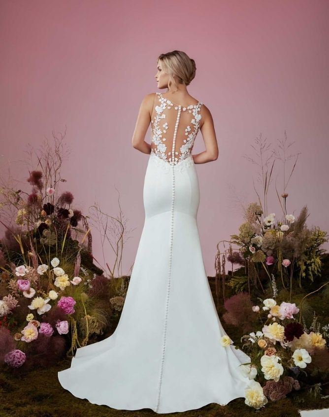 Model wearing a white Anne Barge gown