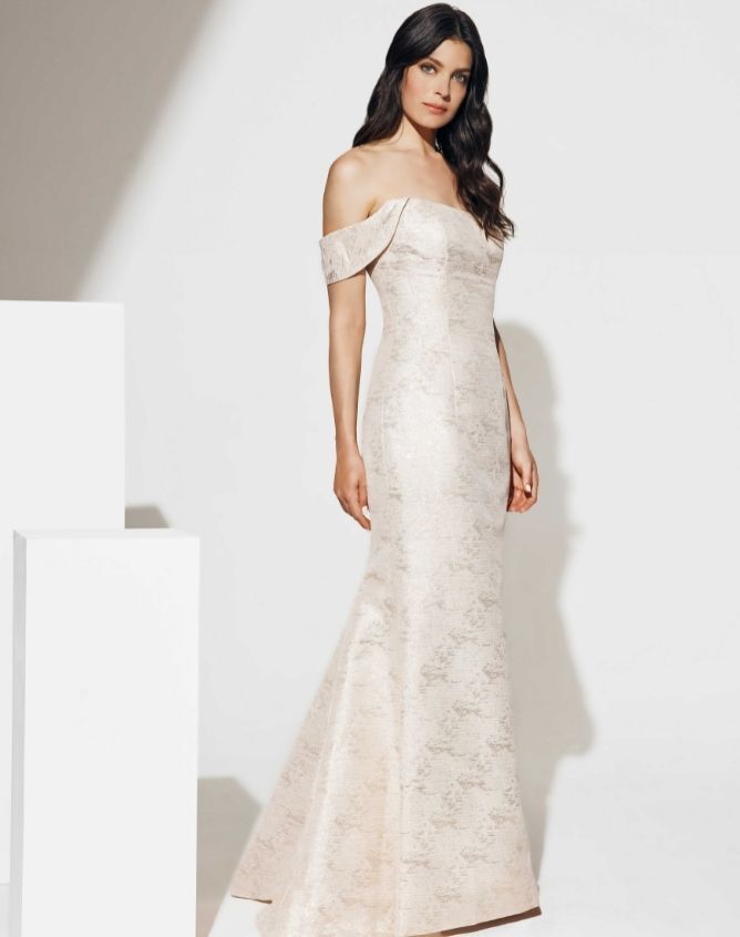 Model wearing a white Anne Barge gown