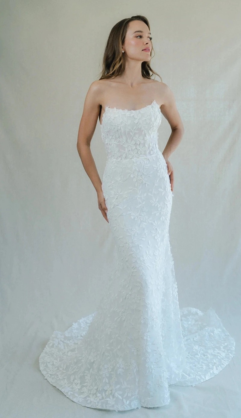 Model wearing a white Anne Barge gown