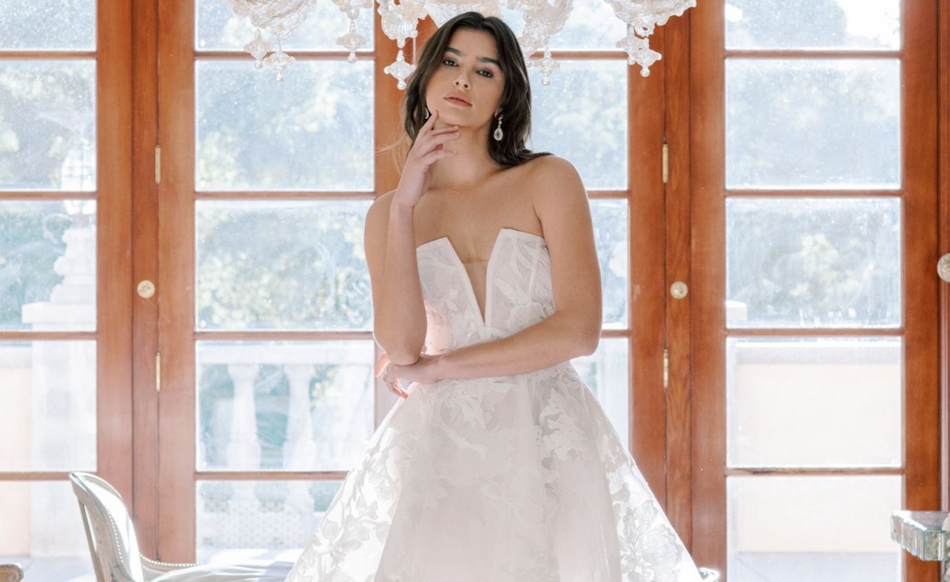Model wearing a white Anne Barge gown