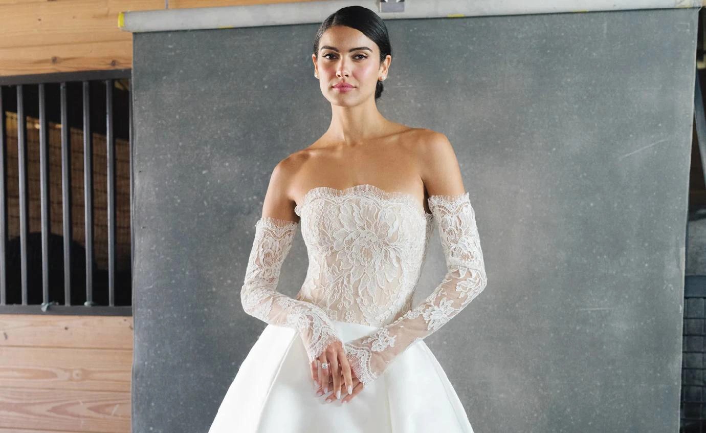 Model wearing a white Anne Barge gown