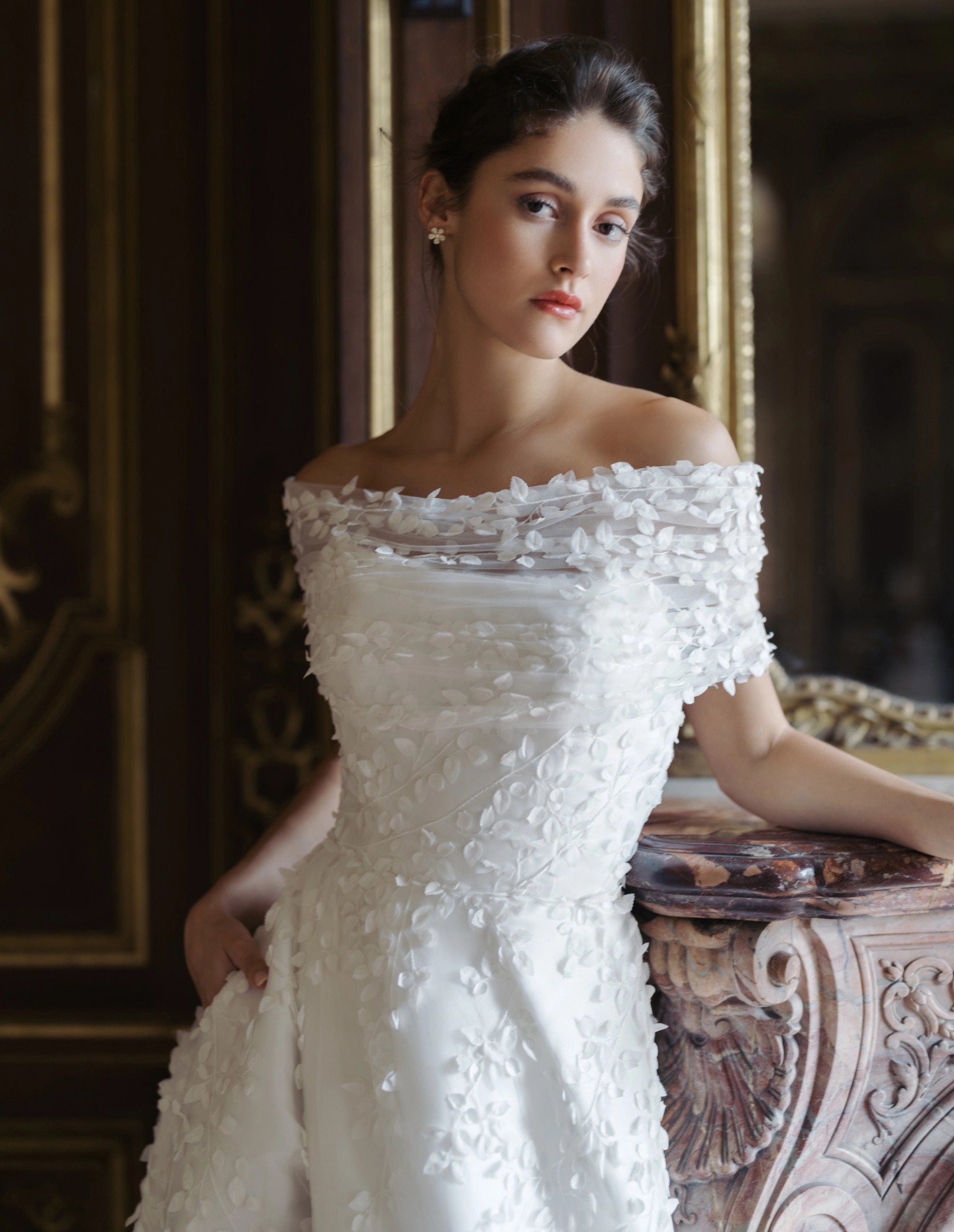 Model wearing a white Blue Willow by Anne Barge gown