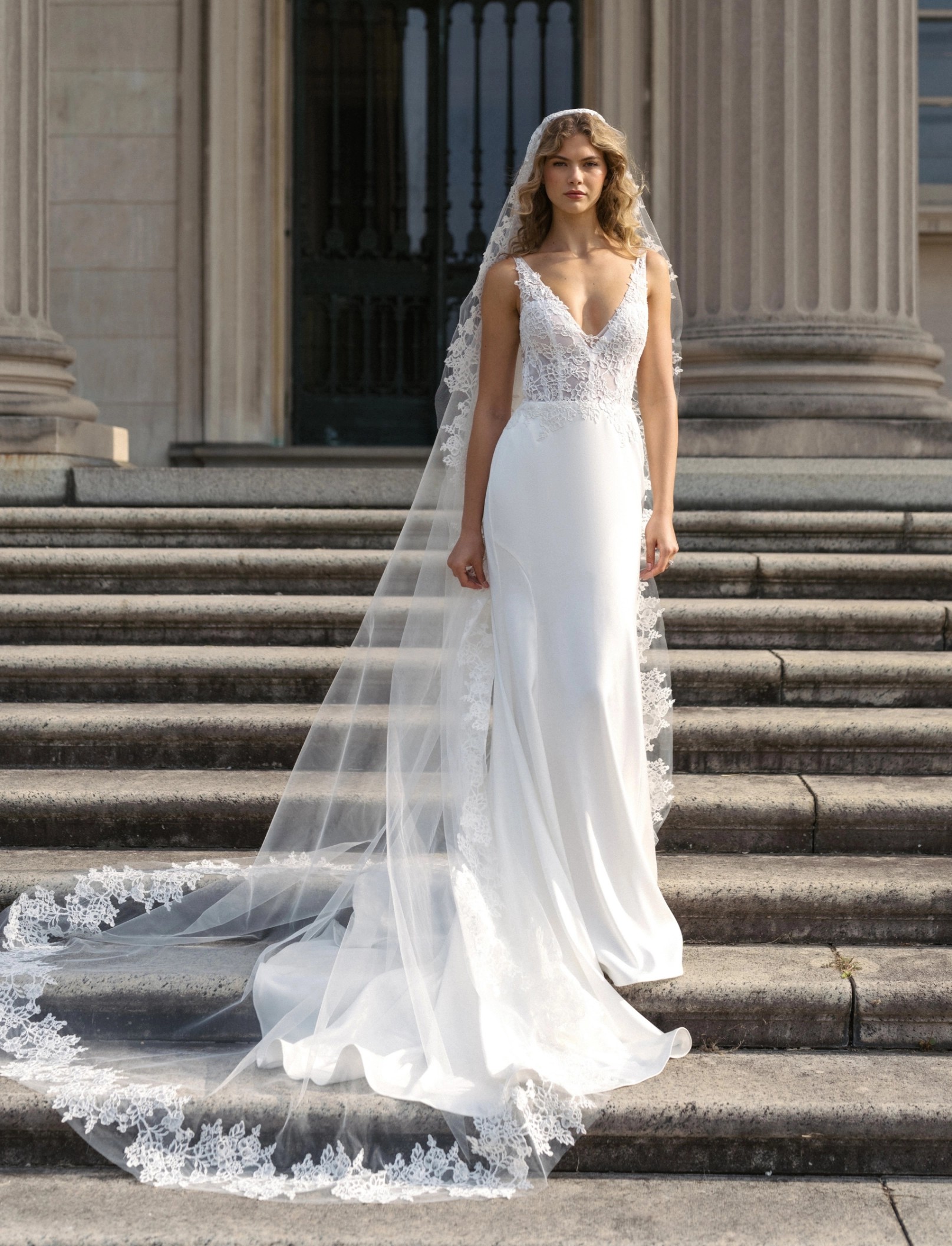 Model wearing a white Anne Barge gown