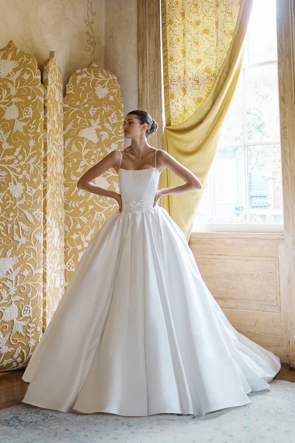 Model wearing a white romantic style gown